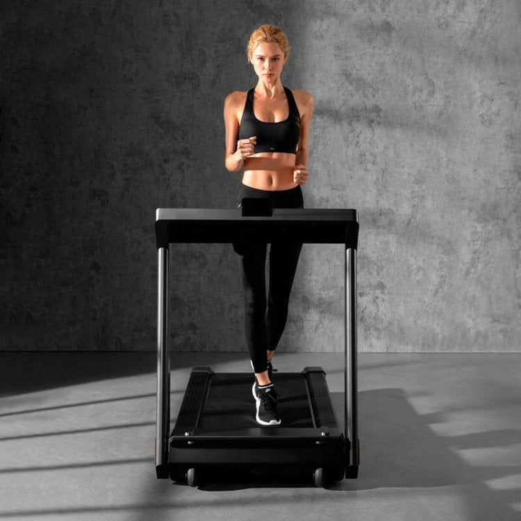 King Smith WalkingPad K15 Foldable Treadmill Front View with Woman Standing